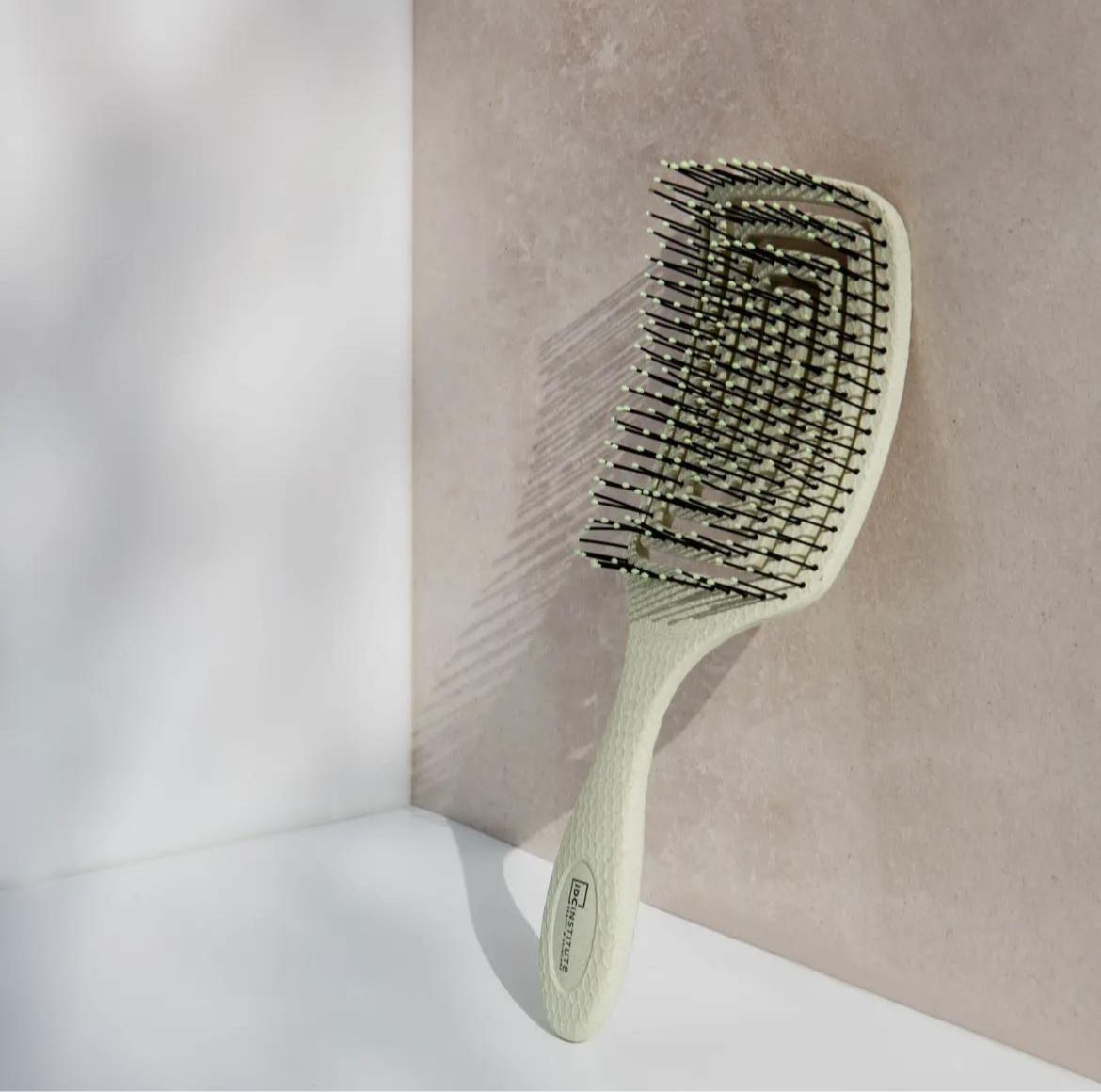 Detangler hair brush in green suitable for smooth and comfortable brushing