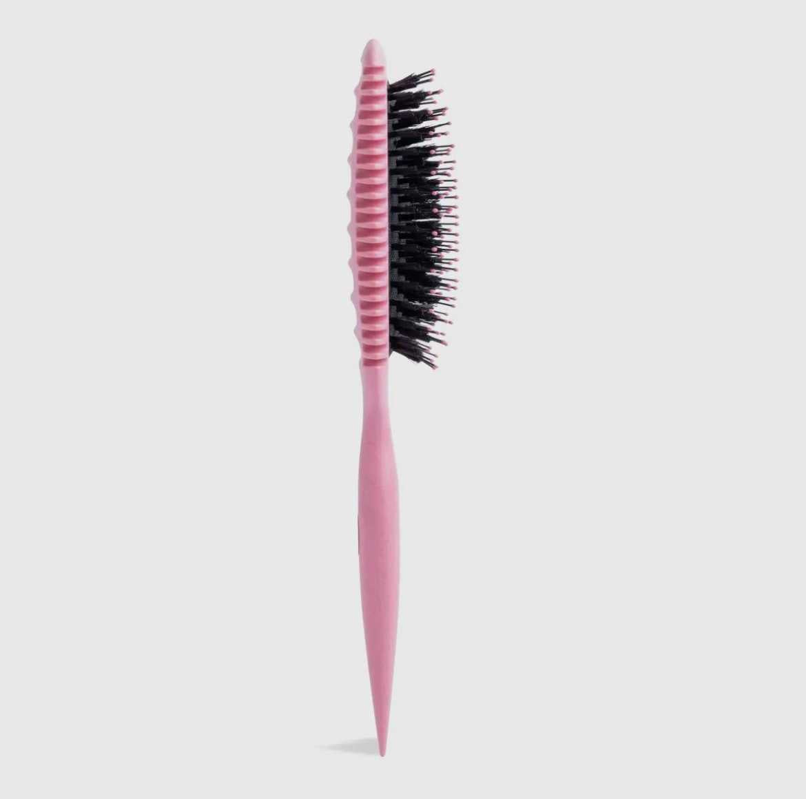 Three colour detangling hair brush set on light background