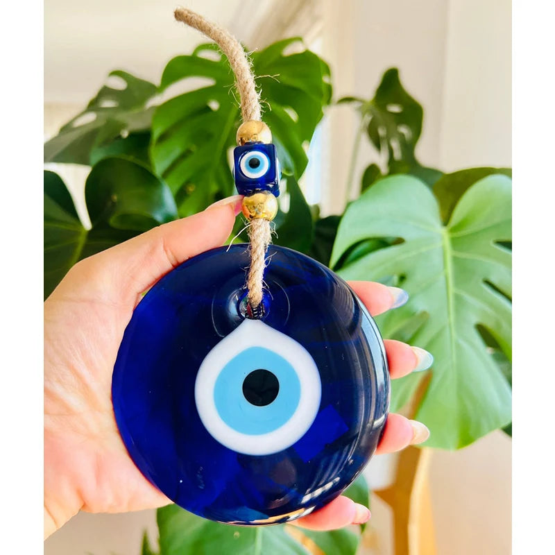 Blue glass evil eye wall amulet for home protection — elegant spiritual wall decor.