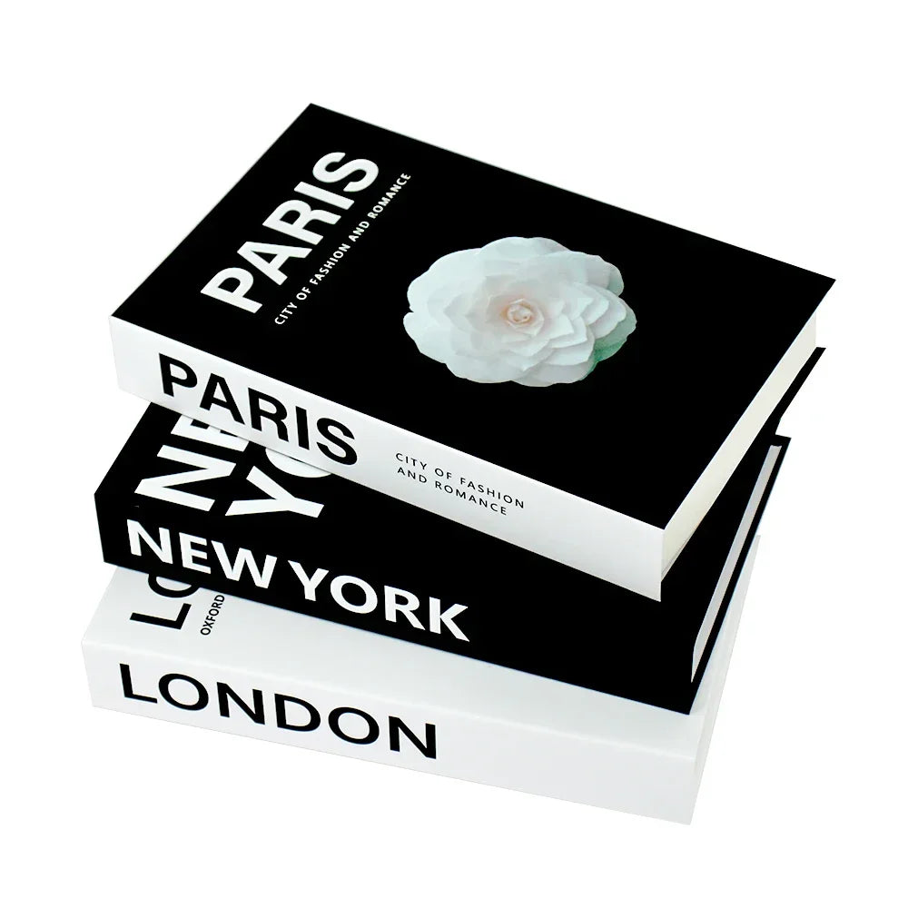 Set of four decorative books titled ‘London’, ‘New York’, and ‘Paris’ with flower illustration, elegant white background