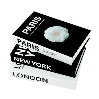 Set of four decorative books titled ‘London’, ‘New York’, and ‘Paris’ with flower illustration, elegant white background