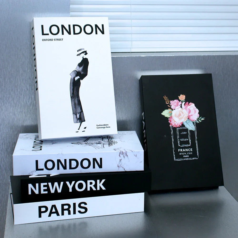 Decorative book set with ‘Paris’ title, minimalist black and white design, modern coffee table decor.