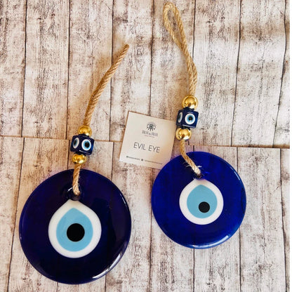 Handmade-style evil eye glass wall hanging — modern protection charm for home interiors