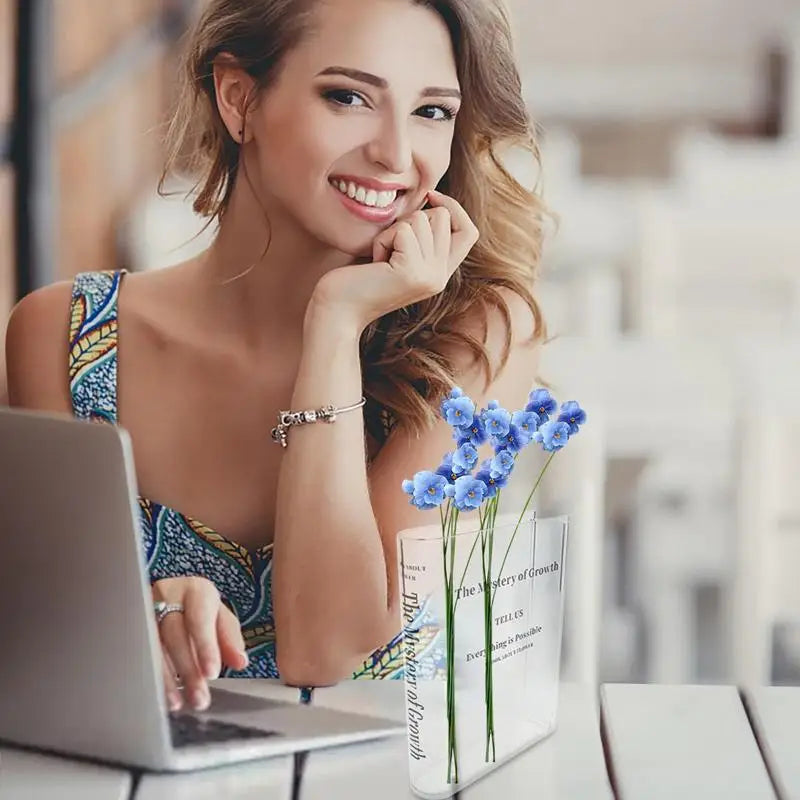Minimalist acrylic vase with fresh blooms — a chic tabletop decor piece for modern homes.