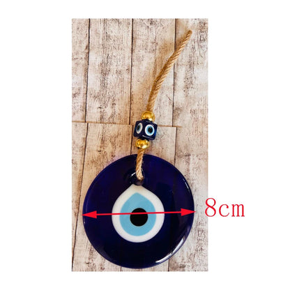 Modern evil eye ornament with smooth glass finish — minimalist wall accent for spiritual interiors.