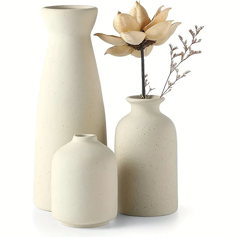 Modern minimalist set of 3 ceramic vases on dark table background.