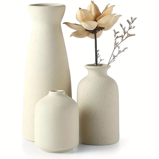 Modern minimalist set of 3 ceramic vases on dark table background.